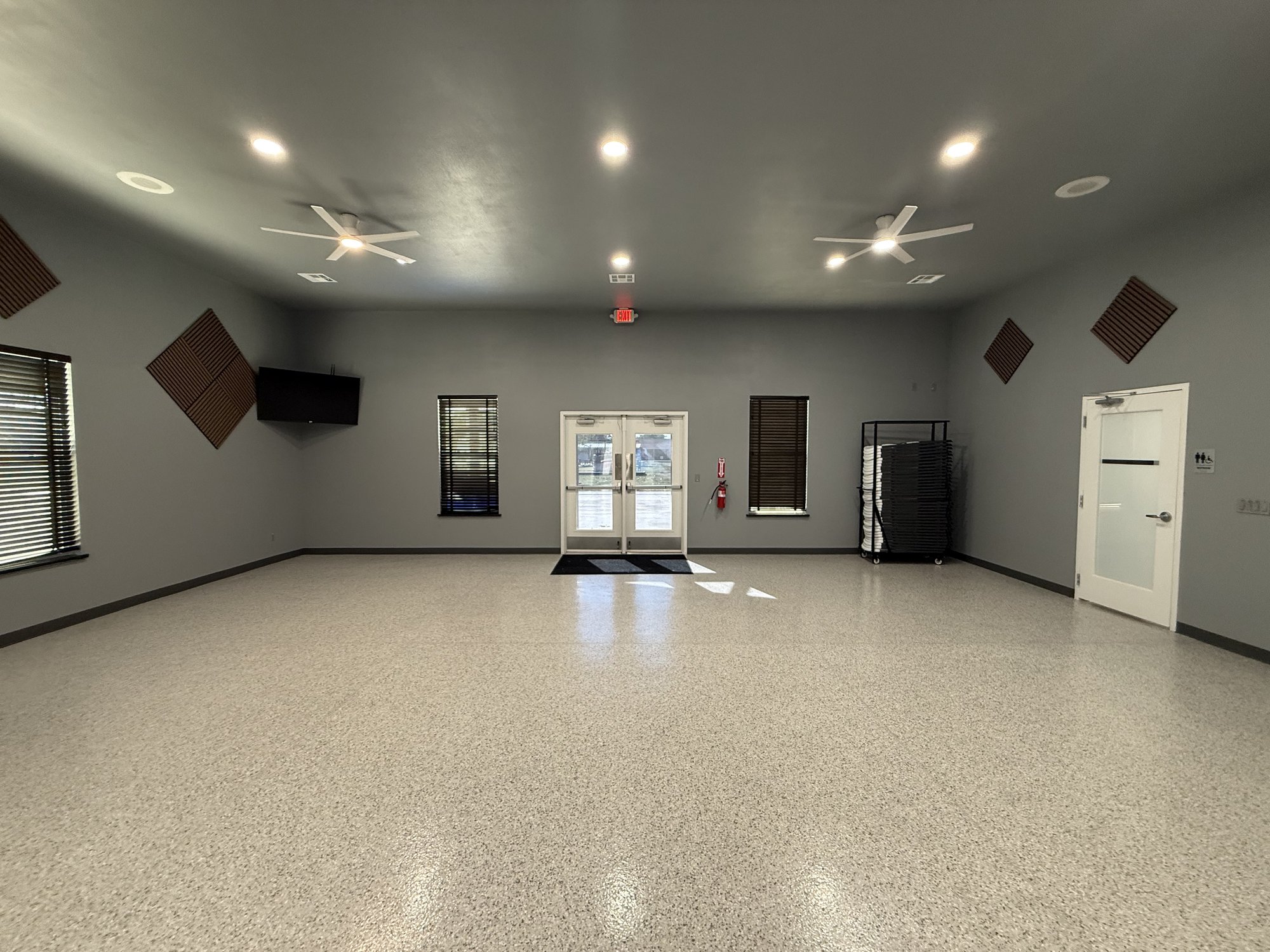 Community Room main hall looking toward the glass entrance doors