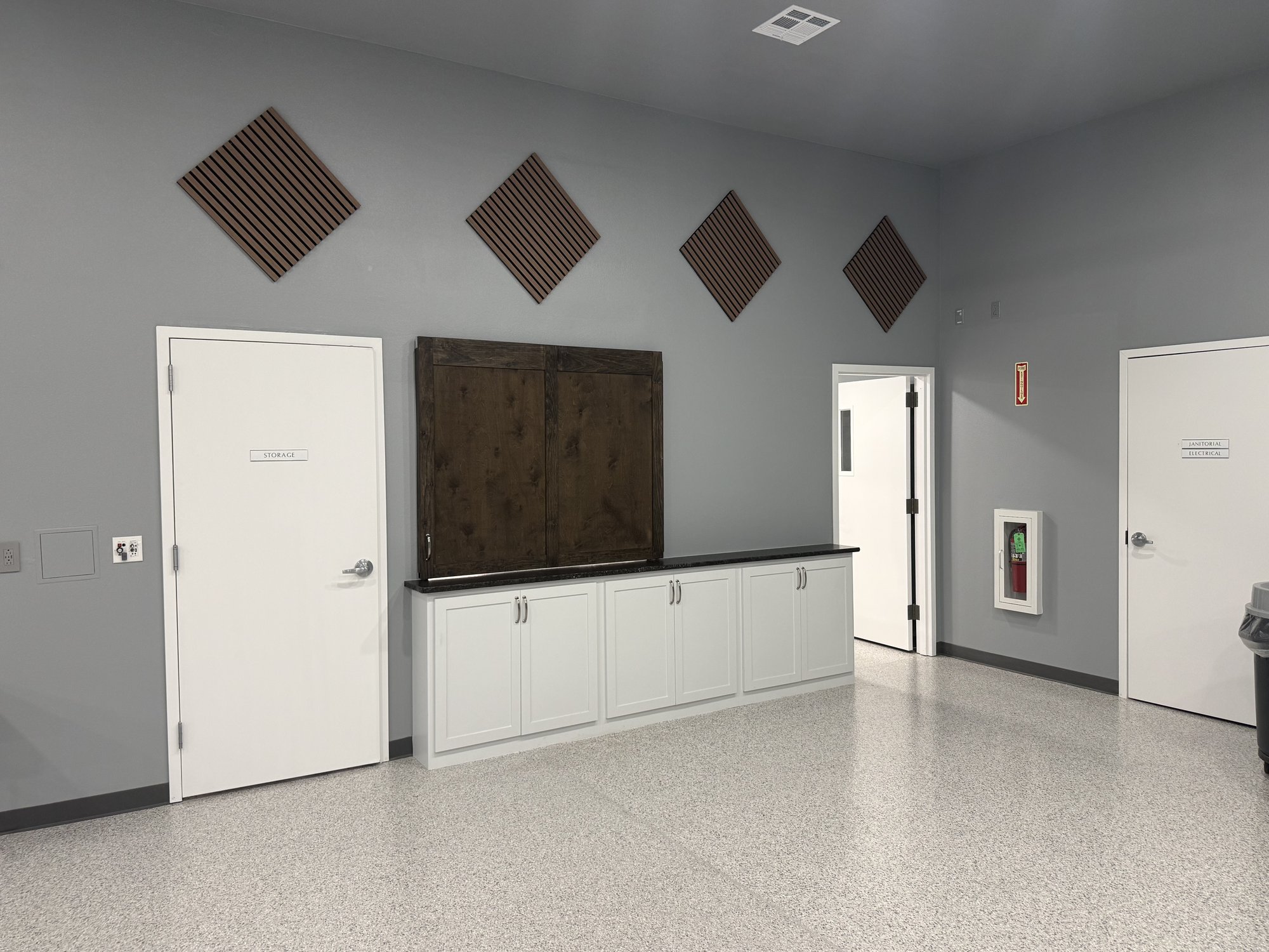 Service counter, storage door, and acoustic panels in the Community Room
