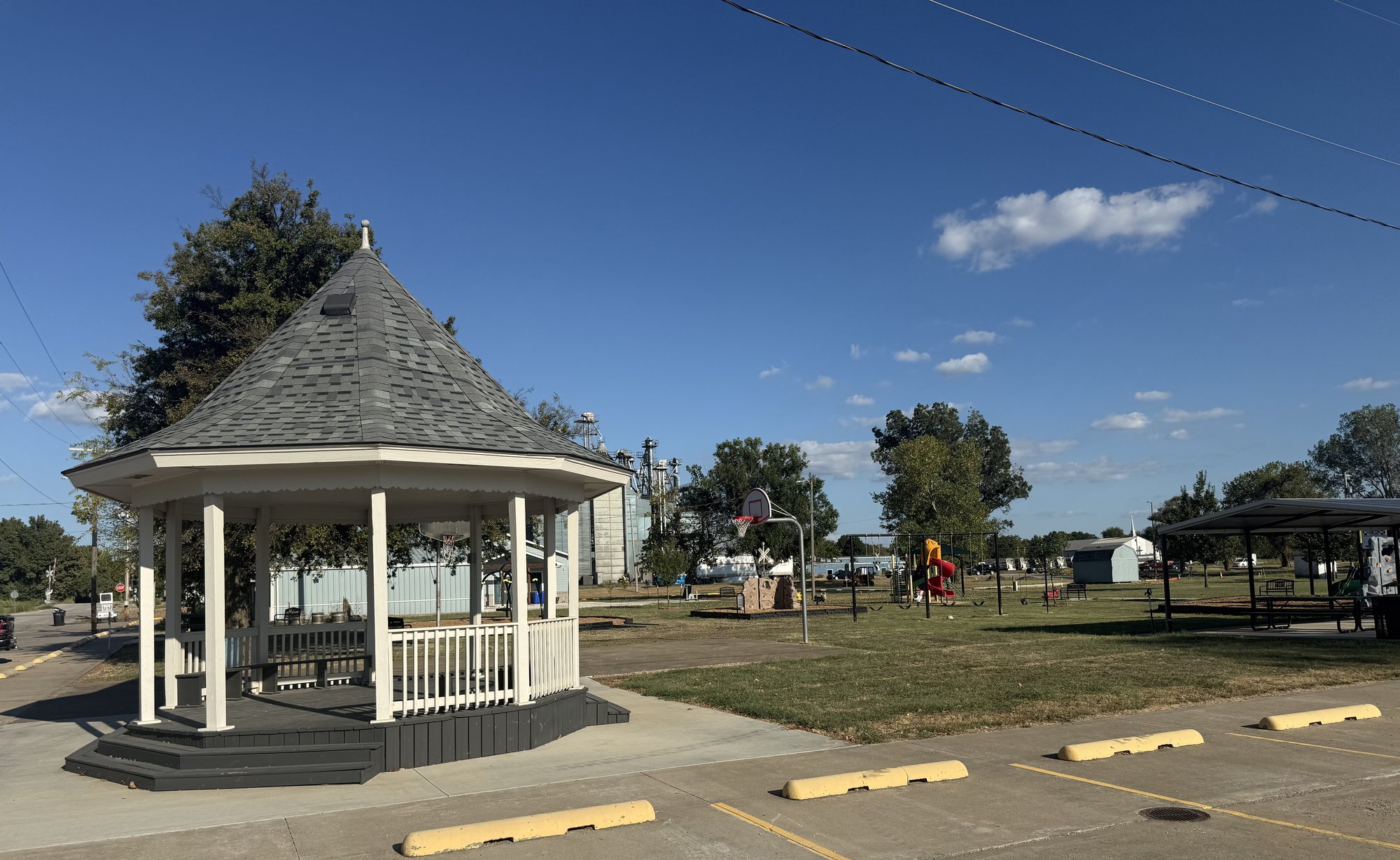 Gazebo with grain elevators and playground beyond